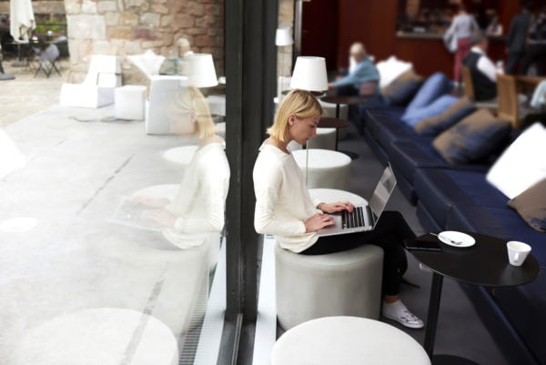 Female,Student,Connecting,To,Wireless,Via,Laptop,Computer,While,Sitting